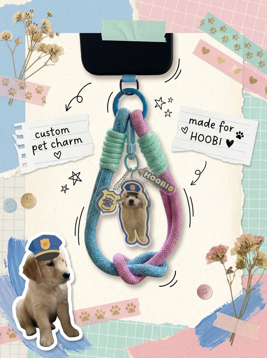 Personalized pet photo phone charm attached to a woven wrist strap